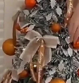 Bronze Snowfall cream bow and bronze ribbon, close-up from the product demonstration