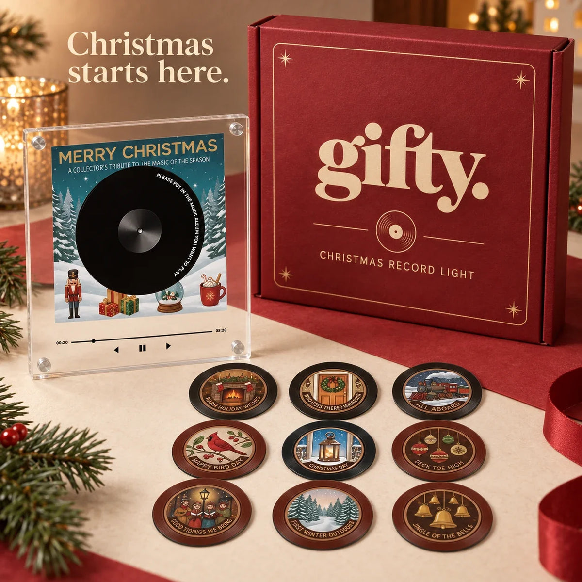 Gifty Christmas Record Light with nine illustrated discs and its included cranberry Gifty Christmas gift box