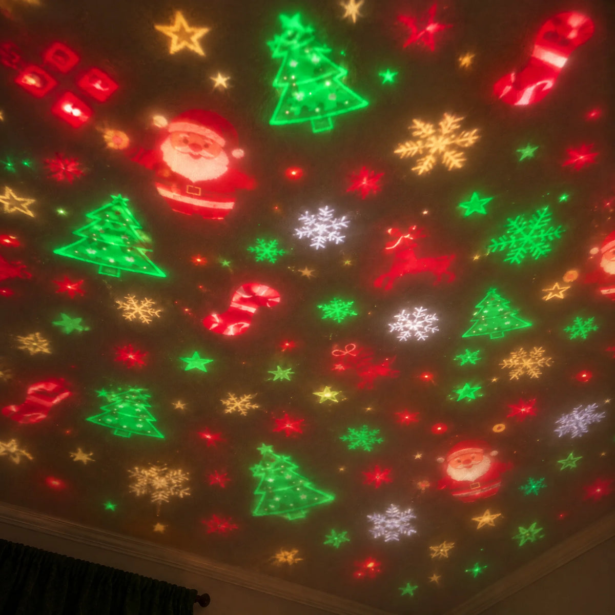 Festive Santa, tree, stocking, star and snowflake projections across a warm living-room ceiling.